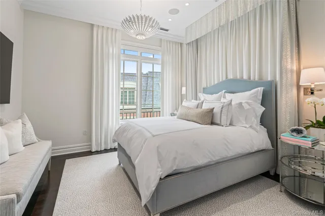 a bedroom with a bed and a night stand