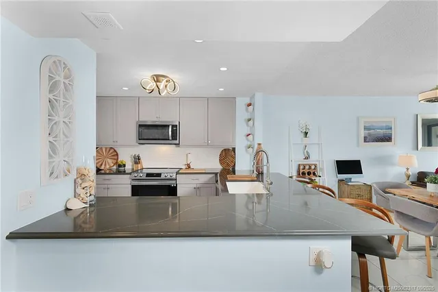 a view of living room with furniture and flat screen tv