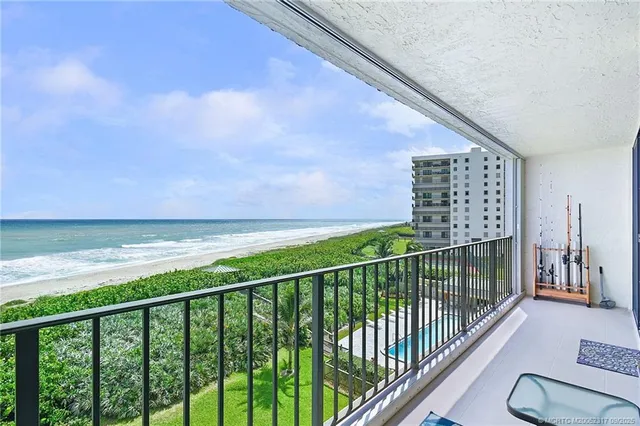 a view of balcony with yard