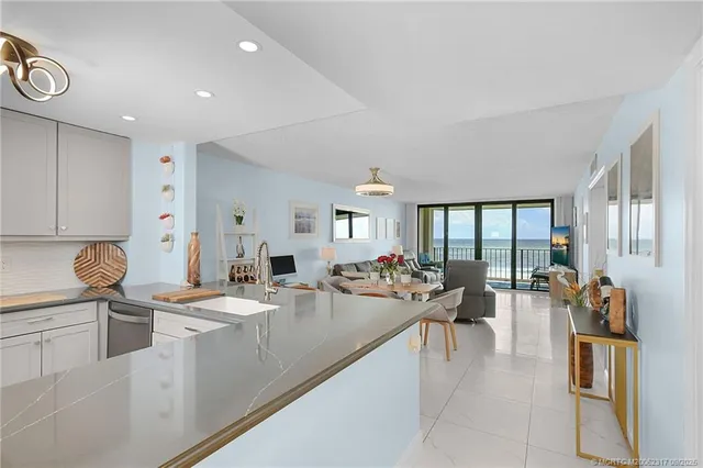 a large white kitchen with lots of counter top space