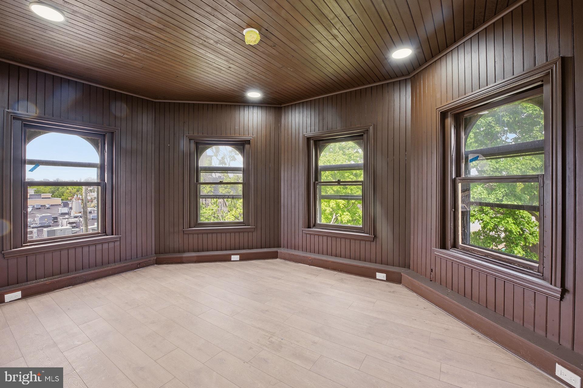 6012 Ridge Avenue, Unit 7 Philadelphia, PA 19128 - Photo 4 of 17 an empty room with windows
