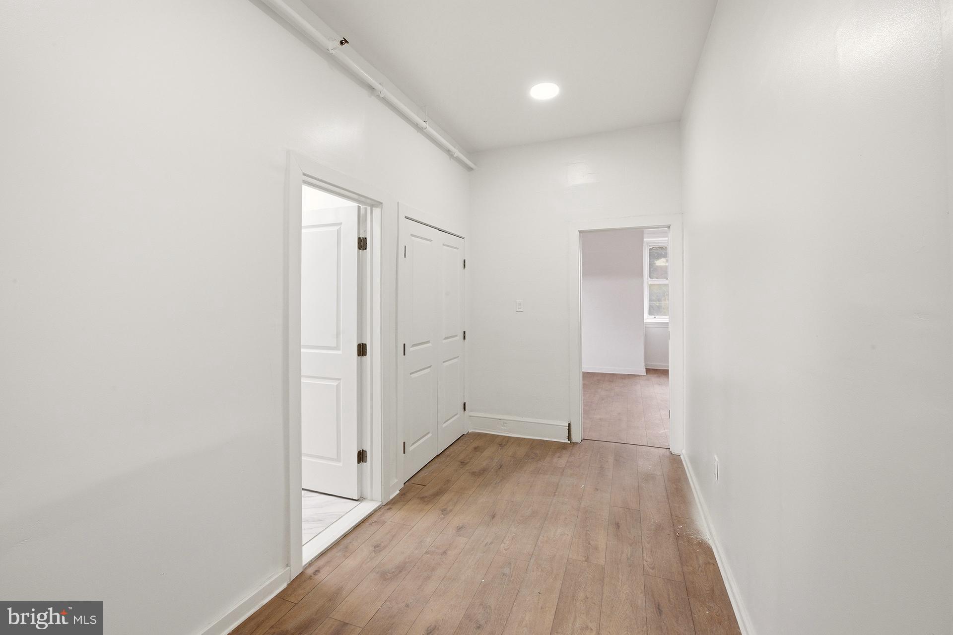 6012 Ridge Avenue, Unit 7 Philadelphia, PA 19128 - Photo 6 of 17 a view of hallway with wooden floor