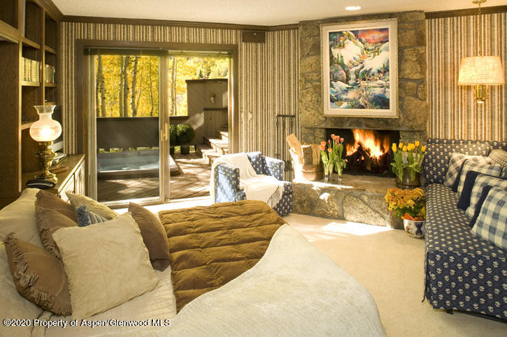 1441 Crystal Lake Road, Unit 2 Aspen, CO 81611 - Photo 11 of 20 a bedroom with furniture and large windows