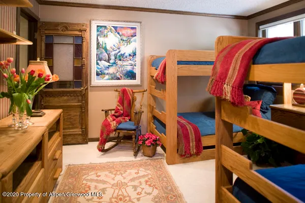 a view of a bedroom with a lot of stuff and furniture