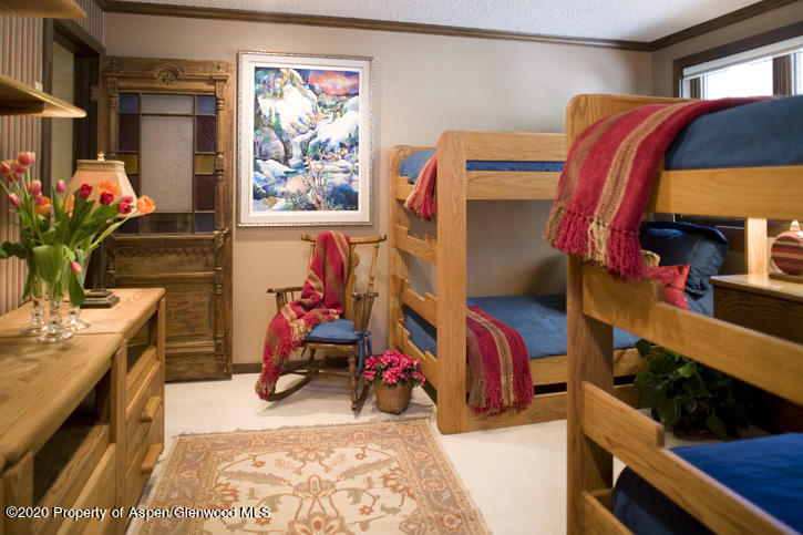 1441 Crystal Lake Road, Unit 2 Aspen, CO 81611 - Photo 12 of 20 a view of a bedroom with a lot of stuff and furniture