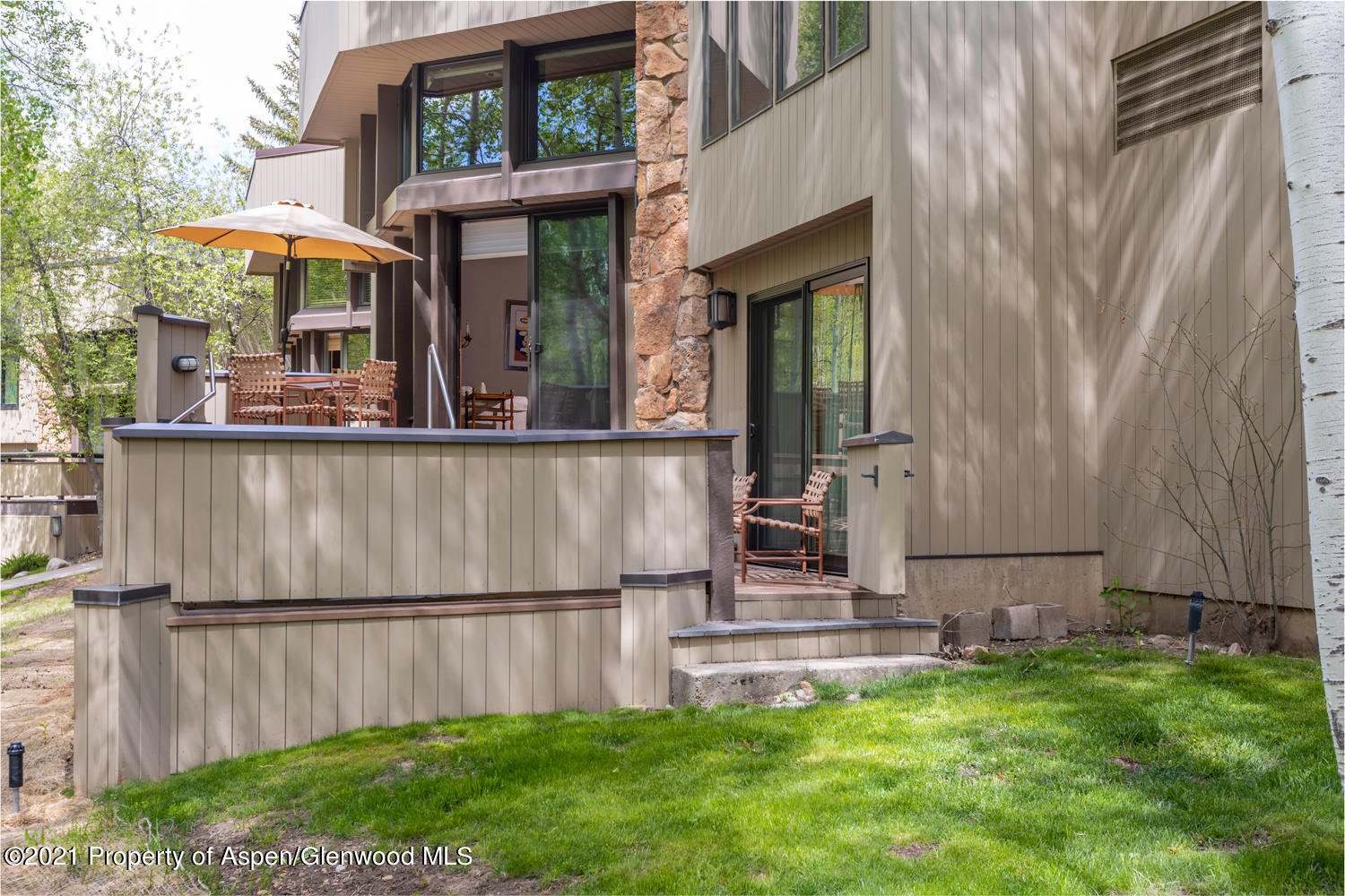 1441 Crystal Lake Road, Unit 2 Aspen, CO 81611 - Photo 17 of 20 a view of a house with a yard and sitting area