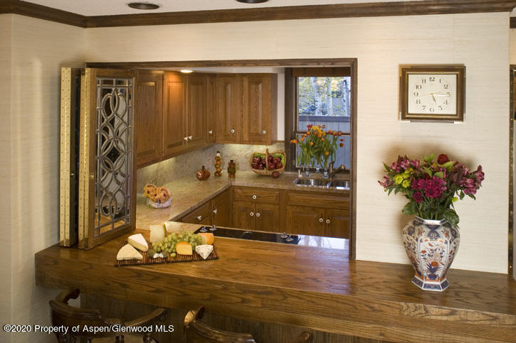 1441 Crystal Lake Road, Unit 2 Aspen, CO 81611 - Photo 8 of 20 a living room with furniture flowerpot and wooden floor
