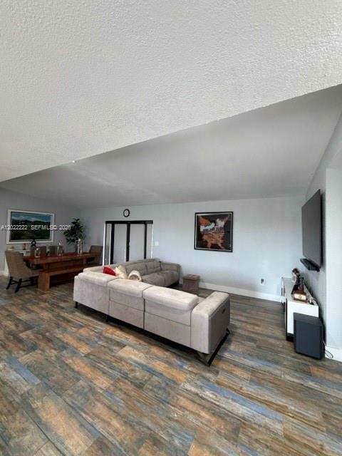 20465 Southwest 200th Street Miami, FL 33187 - Photo 19 of 36 a bedroom with furniture and a night stand