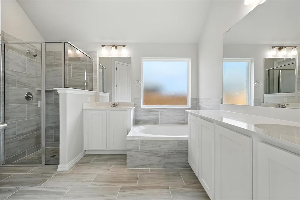 2311 Ridgecrest Lane Sherman, TX 75092 - Photo 16 of 40 a bathroom with a bathtub and a sink
