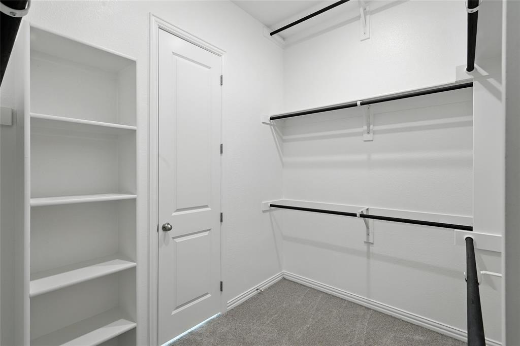 2311 Ridgecrest Lane Sherman, TX 75092 - Photo 20 of 40 a view of an empty walk in closet