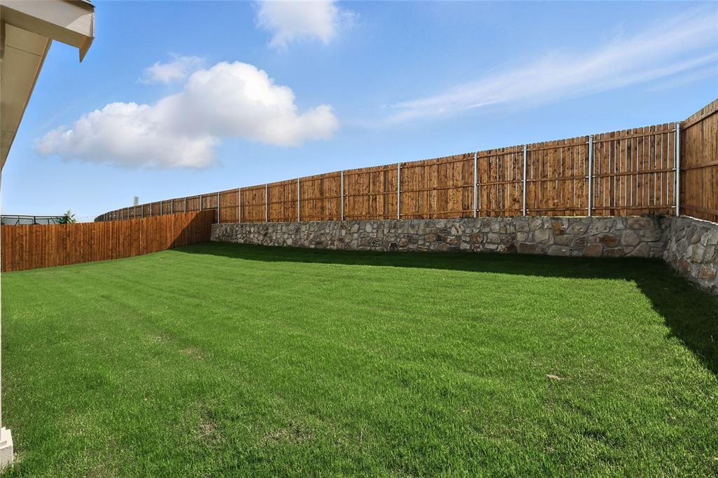 2311 Ridgecrest Lane Sherman, TX 75092 - Photo 22 of 40 a view of yard with swimming pool and wooden fence