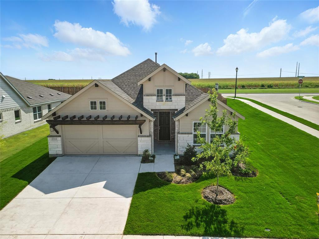 2311 Ridgecrest Lane Sherman, TX 75092 - Photo 28 of 40 a front view of a house with garden
