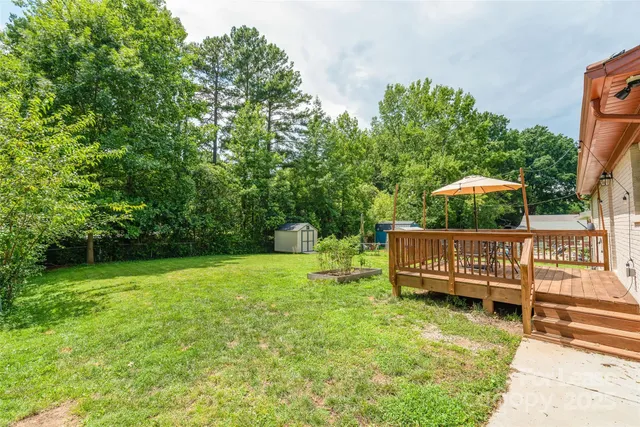 a view of a deck with a yard