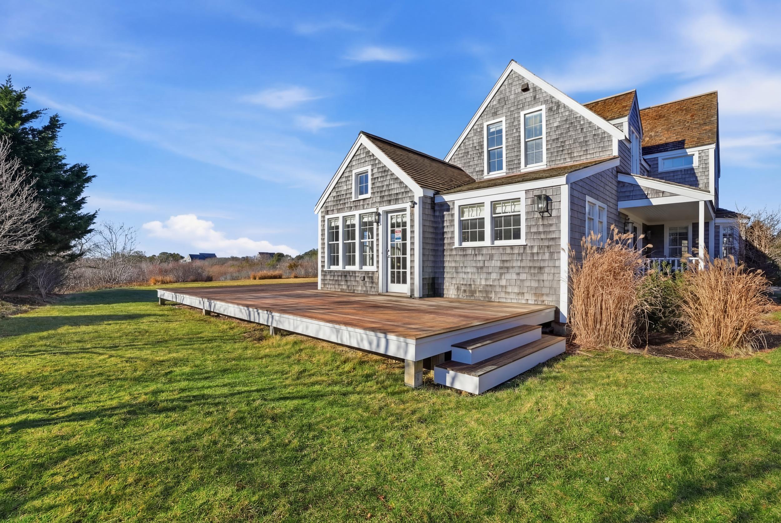 4 Goose Cove Way Nantucket, MA 02554 - Photo 4 of 36 a front view of a house with garden