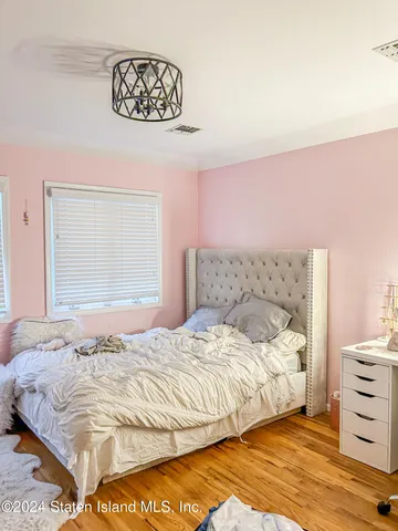 a bathroom with a bathtub and a window