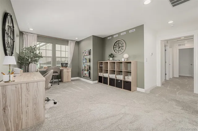 a view of empty room with furniture and window