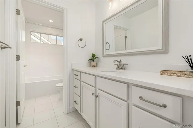 a bathroom with a sink a vanity and a mirror