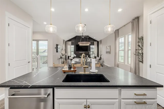 a view of a living room and chandelier