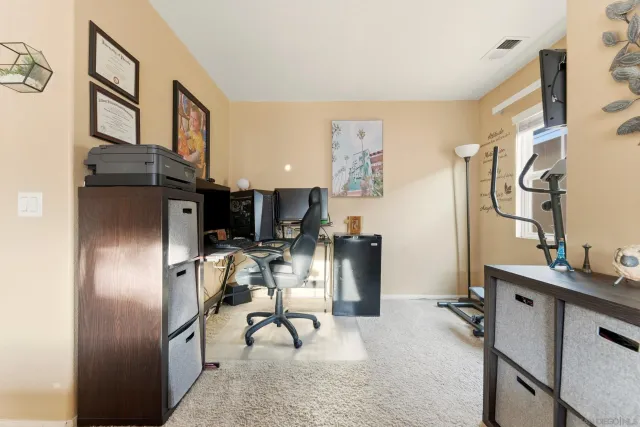 a view of living room with furniture and a window