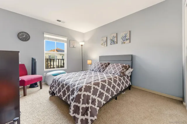 a bedroom with bed and a couch