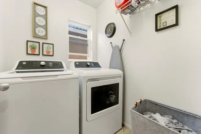 a view of a patio with couches under an umbrella