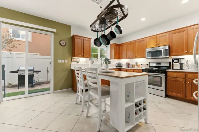 a kitchen with a sink cabinets and window