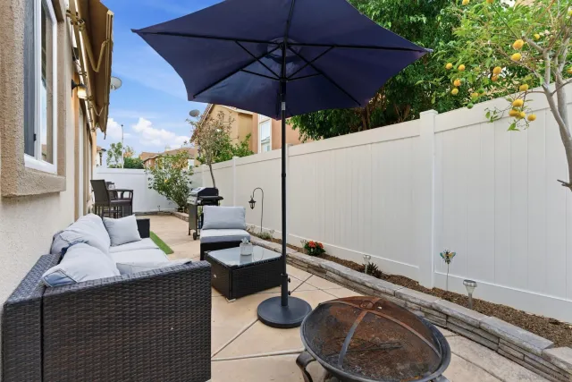 a front view of a house with yard and parking