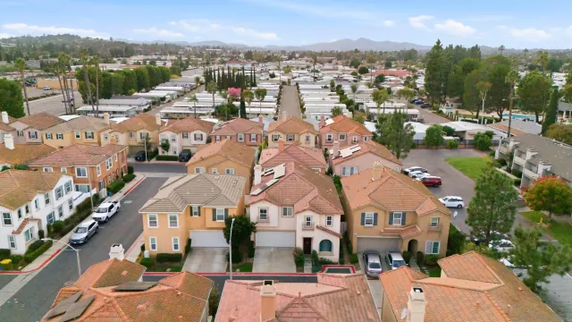 an aerial view of houses with outdoor space