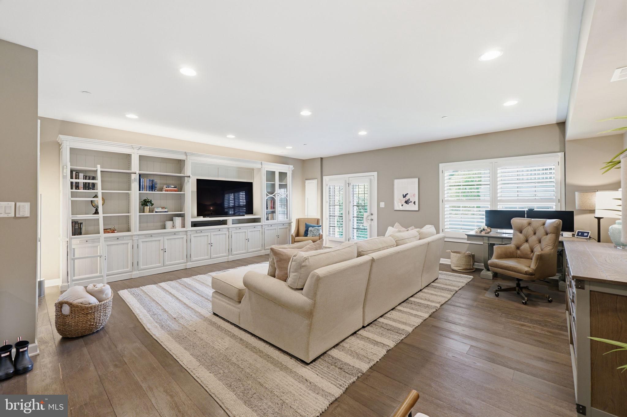 17812 Thomas Village Lane Sandy Spring, MD 20860 - Photo 29 of 37 a living room with furniture and a flat screen tv