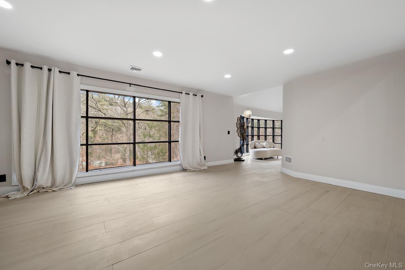 111 Mill River Road Oyster Bay, NY 11771 - Photo 14 of 48 a view of an empty room with a window