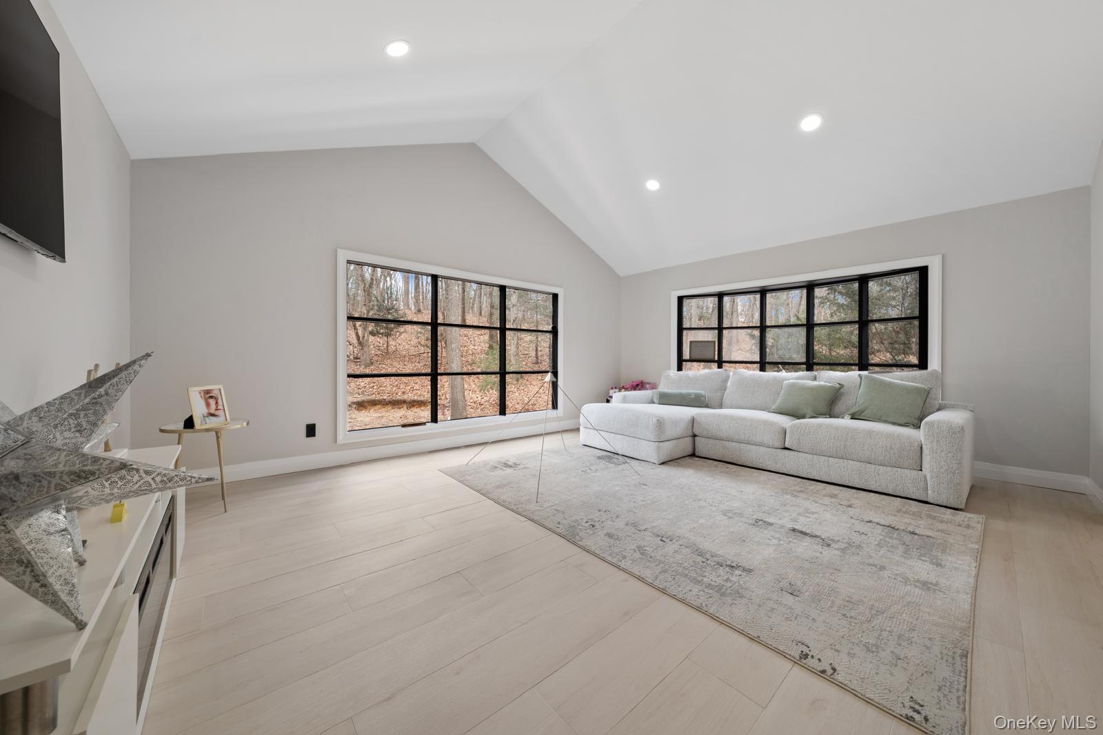 111 Mill River Road Oyster Bay, NY 11771 - Photo 16 of 48 a large bedroom with a large bed and a window