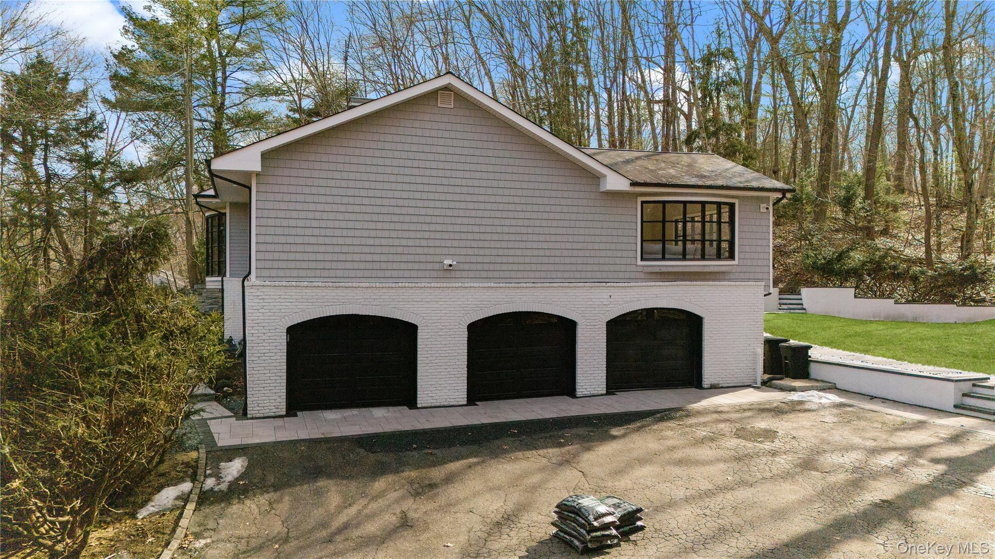 111 Mill River Road Oyster Bay, NY 11771 - Photo 2 of 48 a front view of a house with a yard