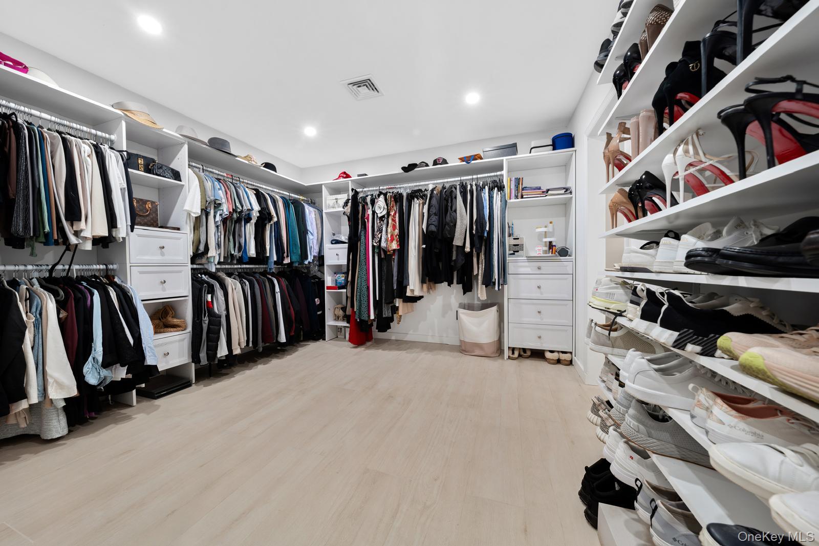 111 Mill River Road Oyster Bay, NY 11771 - Photo 21 of 48 a view of walk in closet with clothes and shoes