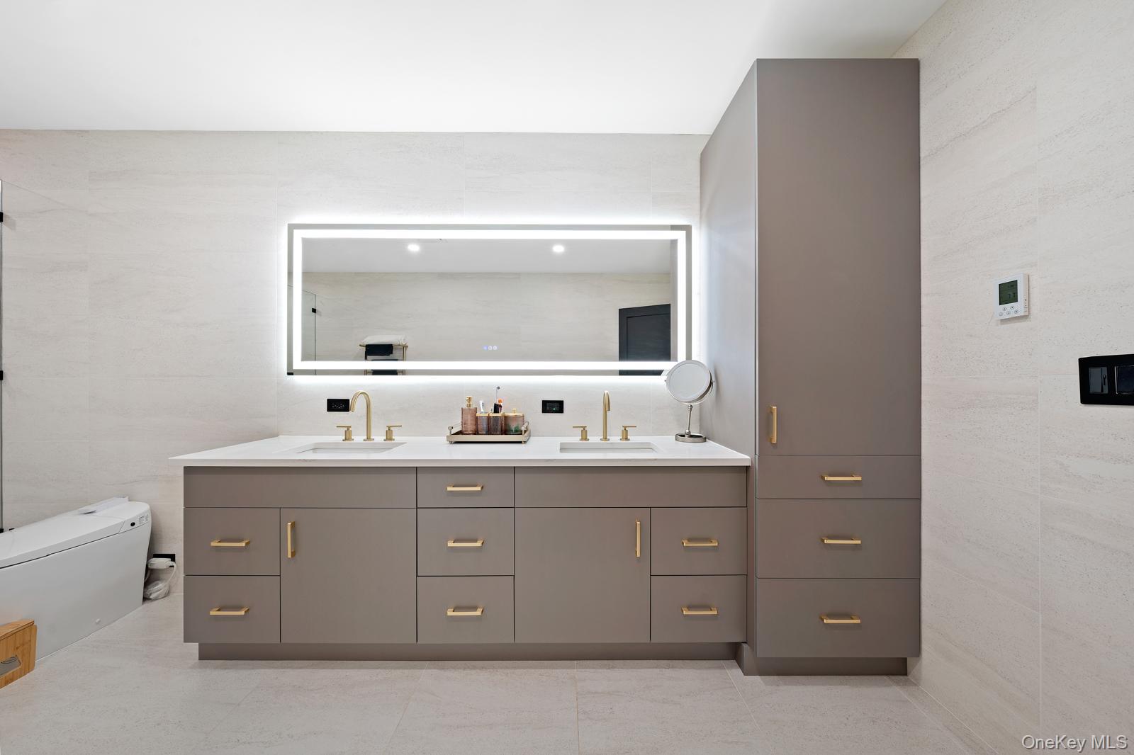 111 Mill River Road Oyster Bay, NY 11771 - Photo 23 of 48 a bathroom with a sink vanity and mirror