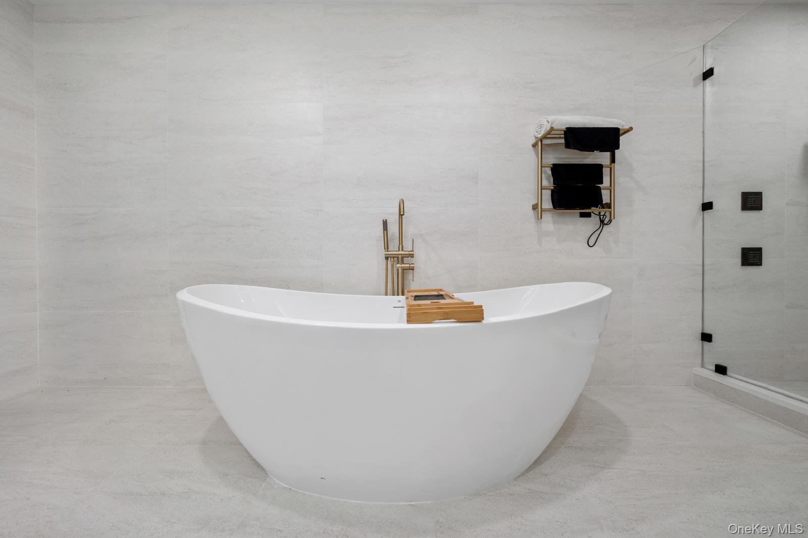 111 Mill River Road Oyster Bay, NY 11771 - Photo 25 of 48 a white tub sitting next to a shower