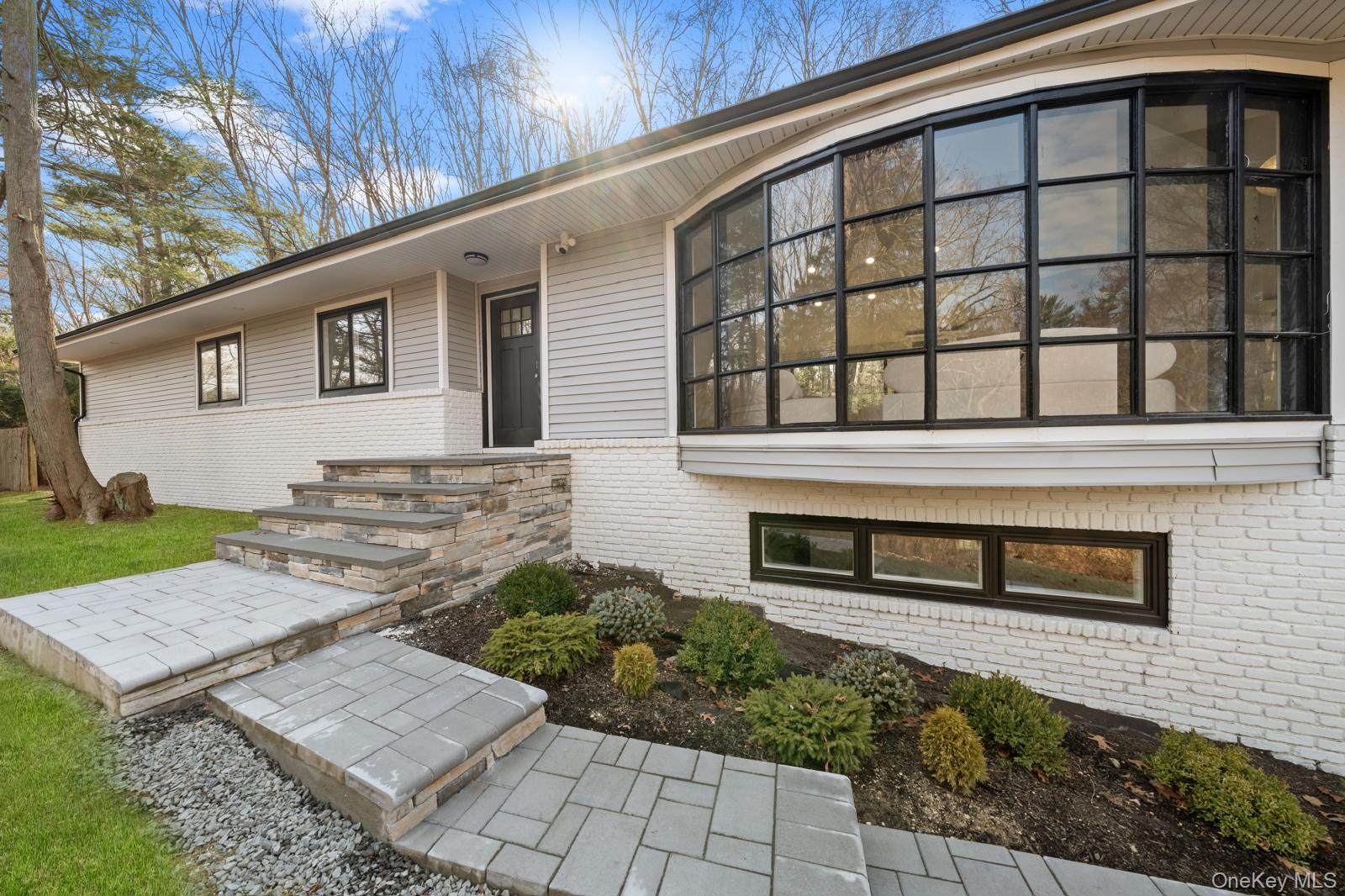111 Mill River Road Oyster Bay, NY 11771 - Photo 3 of 48 a front view of a house with garden