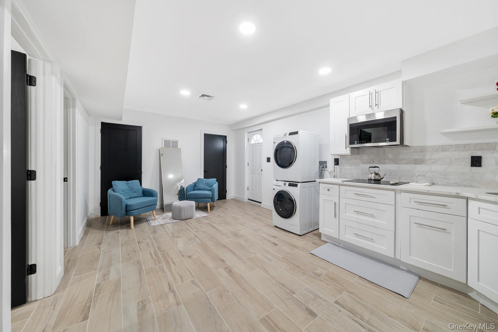 111 Mill River Road Oyster Bay, NY 11771 - Photo 33 of 48 a view of a kitchen with a sink and a refrigerator