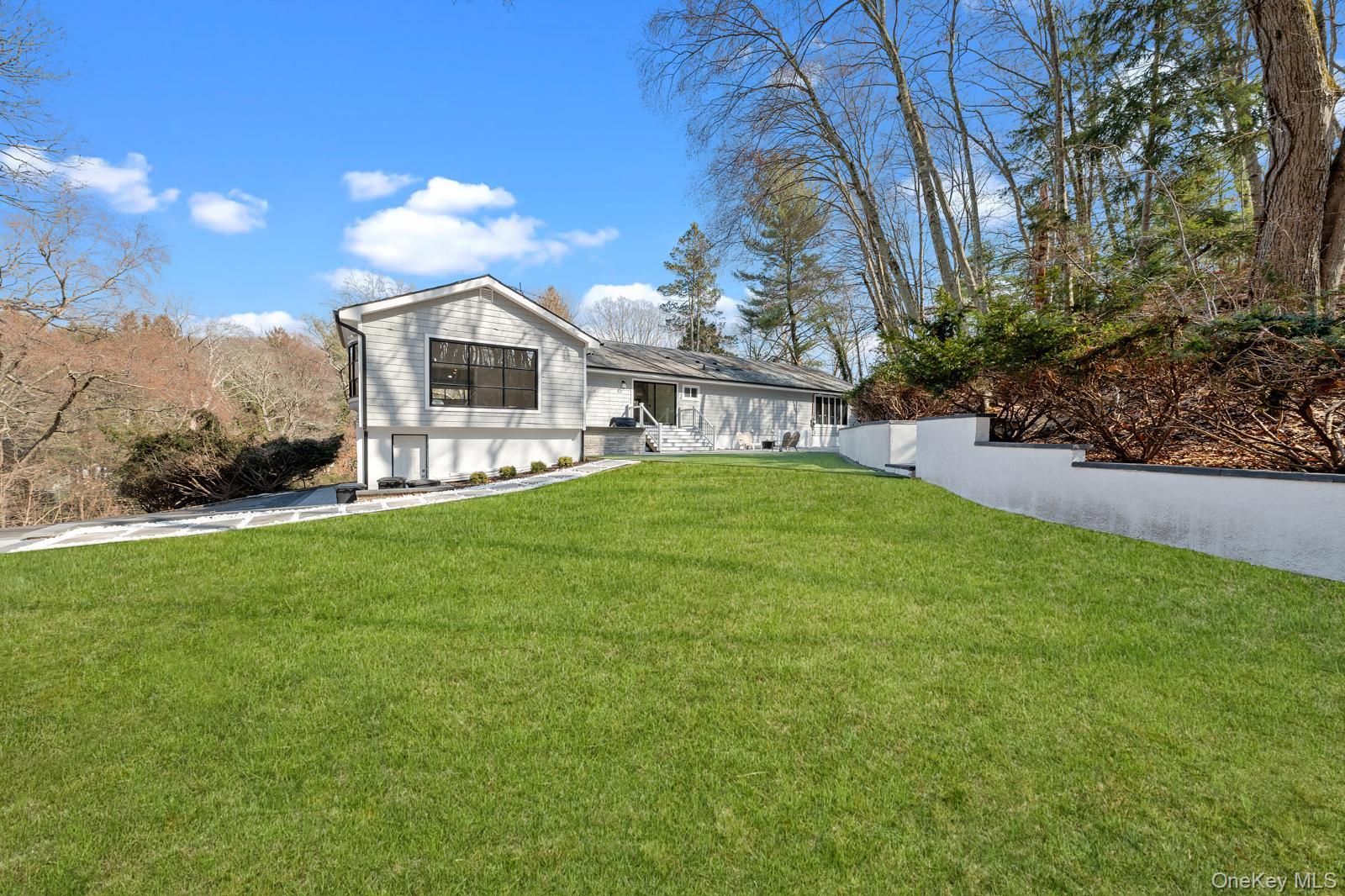 111 Mill River Road Oyster Bay, NY 11771 - Photo 39 of 48 a view of a front of a house with a yard