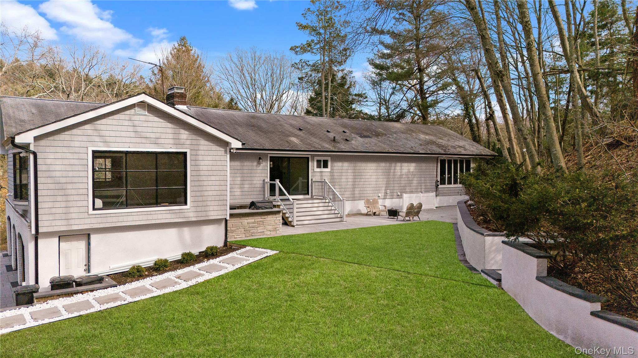 111 Mill River Road Oyster Bay, NY 11771 - Photo 43 of 48 a front view of house with backyard and green space
