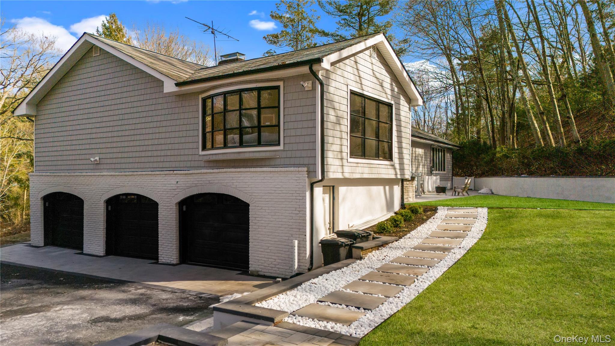 111 Mill River Road Oyster Bay, NY 11771 - Photo 44 of 48 a front view of a house with garden