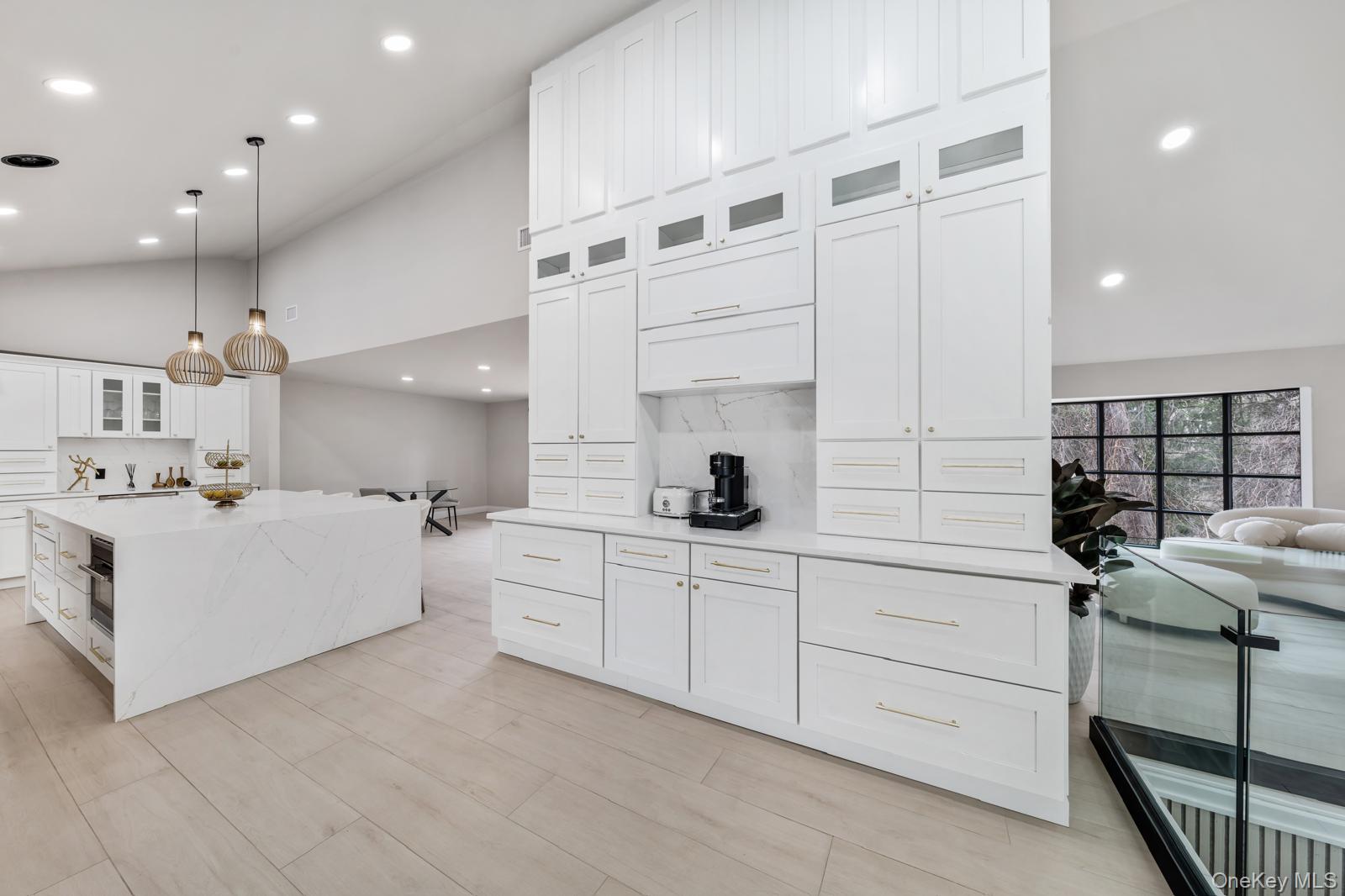 111 Mill River Road Oyster Bay, NY 11771 - Photo 10 of 48 a kitchen with white cabinets and sink