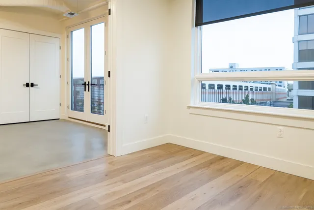 a view of a balcony with wooden floor