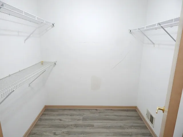 a view of a room with racks on the wall