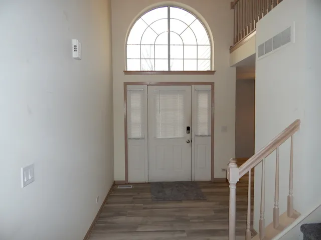 a view of entryway with wooden floor