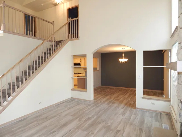 a view of entryway with wooden floor
