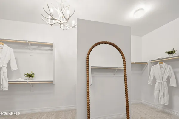 a close view of cabinet with a vase of flowers on it
