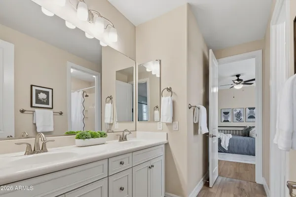 a bathroom with a sink double vanity and shower