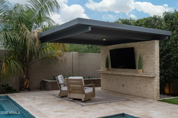 a view of a swimming pool with a patio