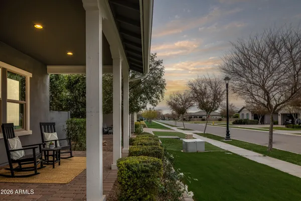 a view of a patio with table and chairs and potted plants