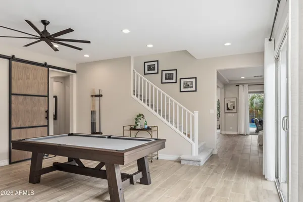 a view of a livingroom with furniture and hardwood floor